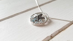 Knobby Starfish Pendant with Blue Topaz